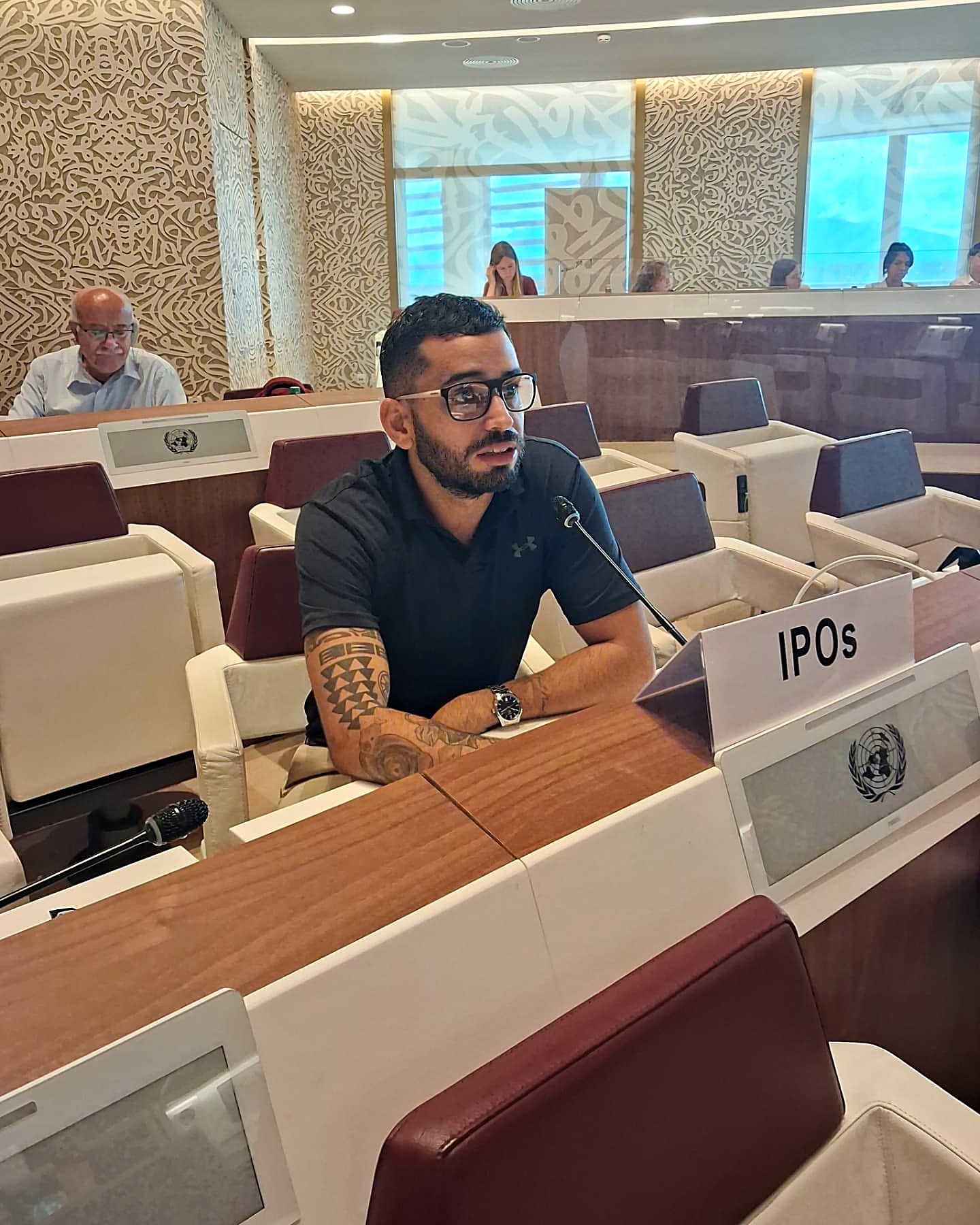 A Garkazi Care leader speaking at an international Indigenous forum.